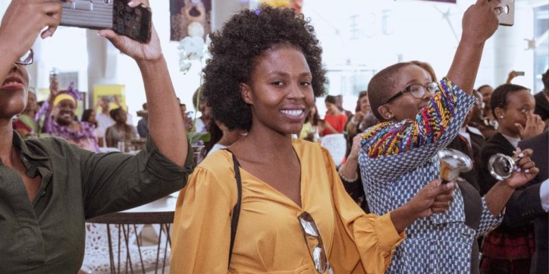 Women ringing the bell at the Johannesburg Stock Exchange for gender equality, wellness and leadership